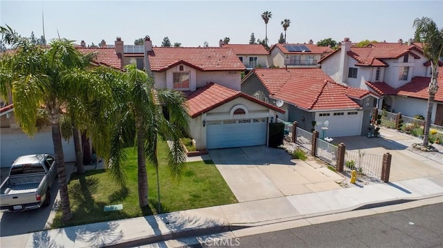 13117 Pan Am Blvd, Moreno Valley, CA 92553 - mediterranean / spanish home with concrete driveway, a garage, a residential view, stucco siding, and a tiled roof