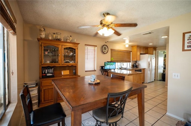 13117 Pan Am Blvd, Moreno Valley, CA 92553 - dining space featuring ceiling fan, a textured ceiling, and light tile patterned flooring
