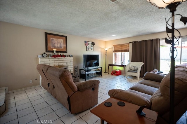 13117 Pan Am Blvd, Moreno Valley, CA 92553 - living area with light tile patterned floors, a textured ceiling, a brick fireplace, and baseboards