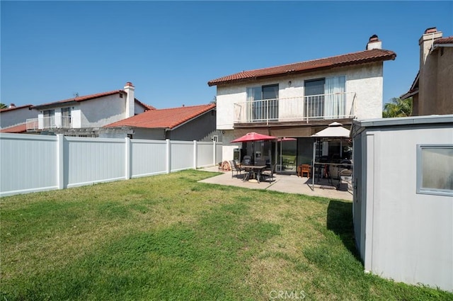 13117 Pan Am Blvd, Moreno Valley, CA 92553 - rear view of property featuring a balcony, a patio, a chimney, and stucco siding