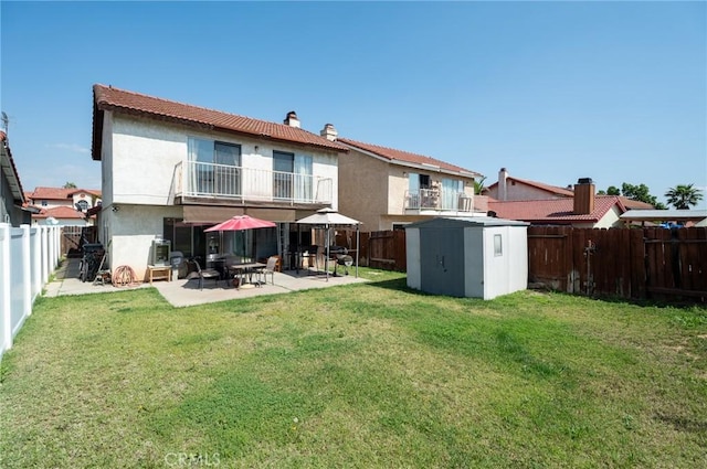 13117 Pan Am Blvd, Moreno Valley, CA 92553 - rear view of house with a balcony, a patio area, stucco siding, and a chimney