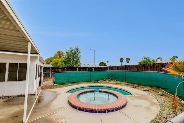 23719 White Owl Ct, Moreno Valley, CA 92553 - view of pool with an in-ground hot tub and a fenced backyard