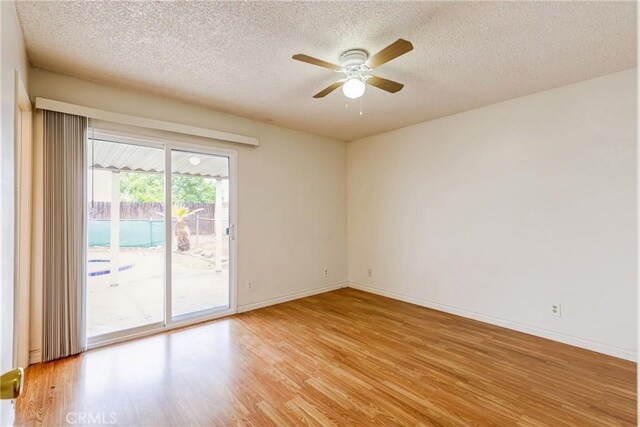 23719 White Owl Ct, Moreno Valley, CA 92553 - empty room featuring a textured ceiling, light wood finished floors, ceiling fan, and baseboards