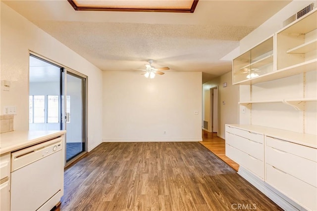 23719 White Owl Ct, Moreno Valley, CA 92553 - unfurnished dining area featuring a ceiling fan, dark wood-style floors, baseboards, and a textured ceiling