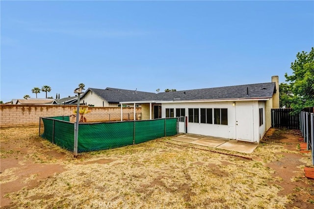 23719 White Owl Ct, Moreno Valley, CA 92553 - rear view of house with a fenced backyard and a patio area
