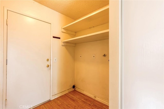 23719 White Owl Ct, Moreno Valley, CA 92553 - laundry area featuring light wood finished floors