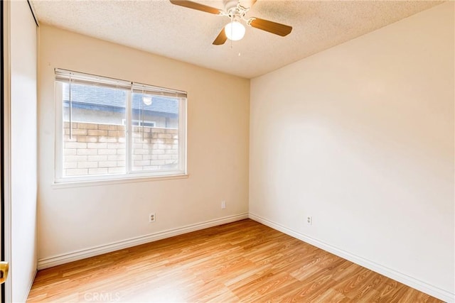 23719 White Owl Ct, Moreno Valley, CA 92553 - empty room featuring light wood-type flooring, a textured ceiling, ceiling fan, and baseboards