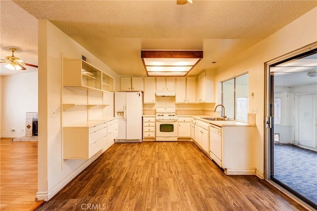 23719 White Owl Ct, Moreno Valley, CA 92553 - kitchen with white appliances, a sink, ceiling fan, wood finished floors, and a textured ceiling