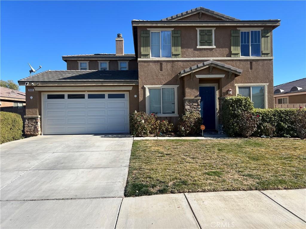 39426 Oxford Rd, Palmdale, CA 93551 - view of front of house with stucco siding, driveway, an attached garage, a front yard, and a tile roof