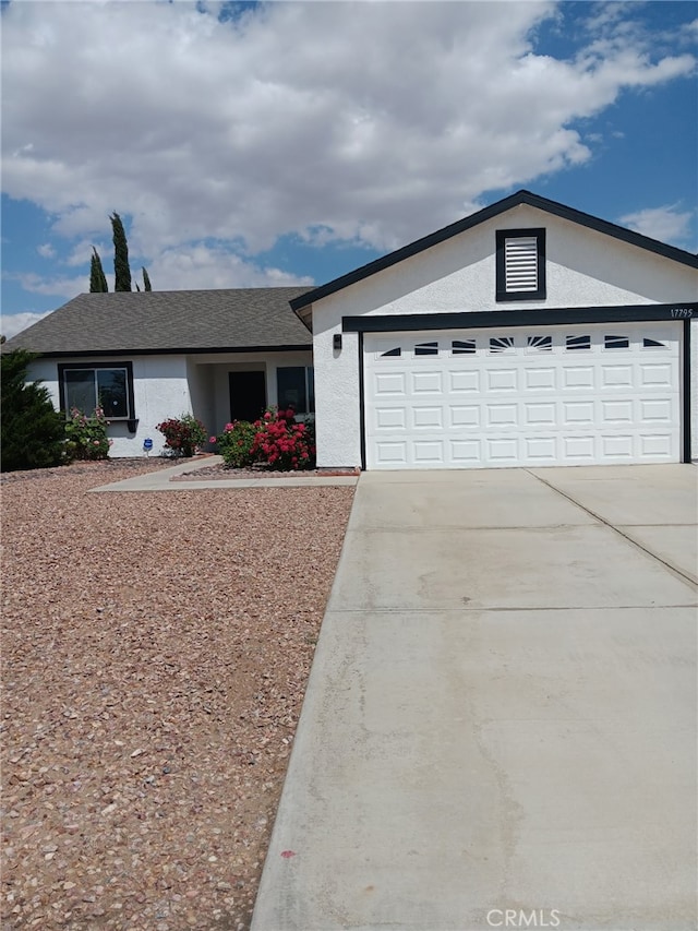 17795 Stevens Rd, Adelanto, CA 92301 - ranch-style home with driveway, stucco siding, and a garage
