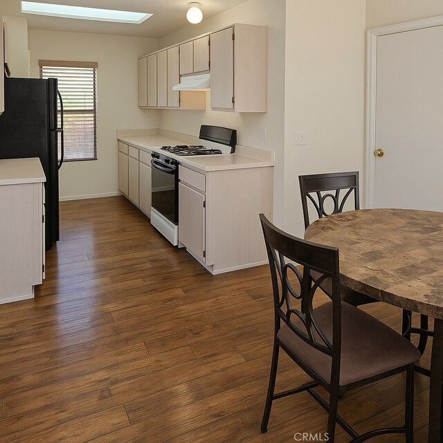 17795 Stevens Rd, Adelanto, CA 92301 - kitchen with gas range oven, dark wood-type flooring, and light countertops