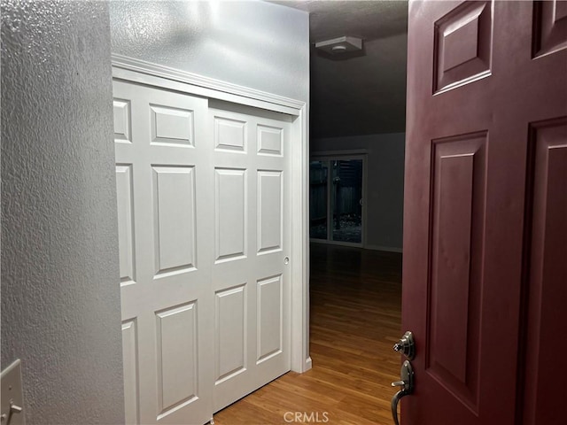 14749 Vassar Ct, Magalia, CA 95954 - hallway with light wood-style flooring and a textured wall