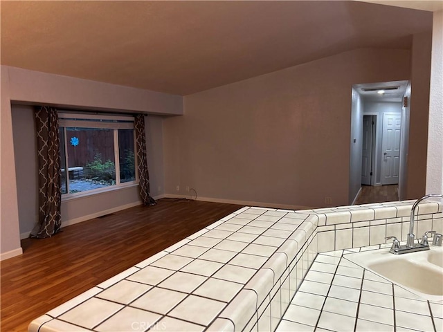 14749 Vassar Ct, Magalia, CA 95954 - unfurnished room with wood finished floors, a sink, and baseboards