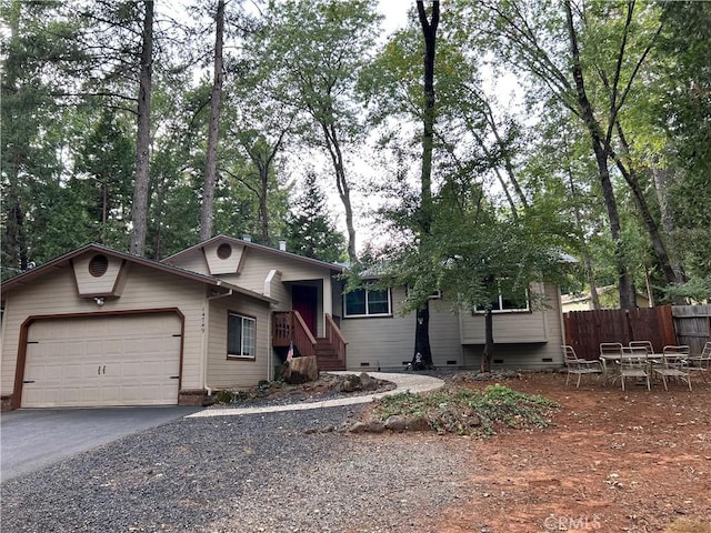14749 Vassar Ct, Magalia, CA 95954 - single story home featuring fence, asphalt driveway, an attached garage, and crawl space