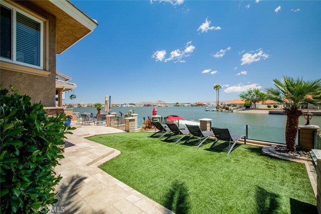 13545 Anchor Dr, Victorville, CA 92395 - view of green lawn with a patio and a water view