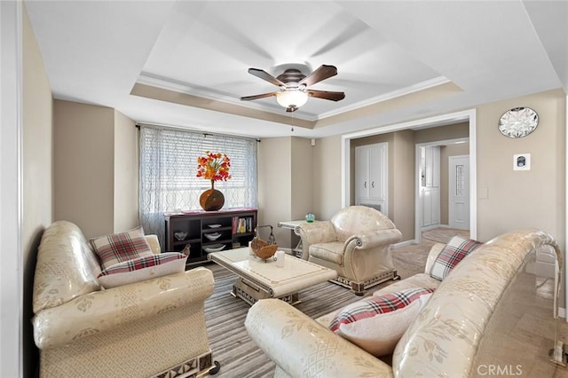 13545 Anchor Dr, Victorville, CA 92395 - living room featuring a raised ceiling, a ceiling fan, and ornamental molding