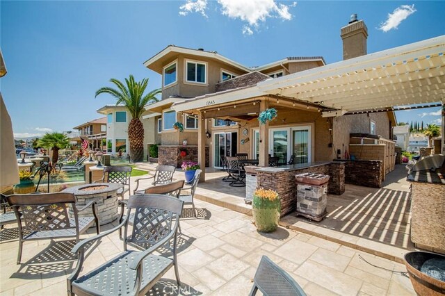 13545 Anchor Dr, Victorville, CA 92395 - view of patio / terrace featuring an outdoor fire pit and a pergola
