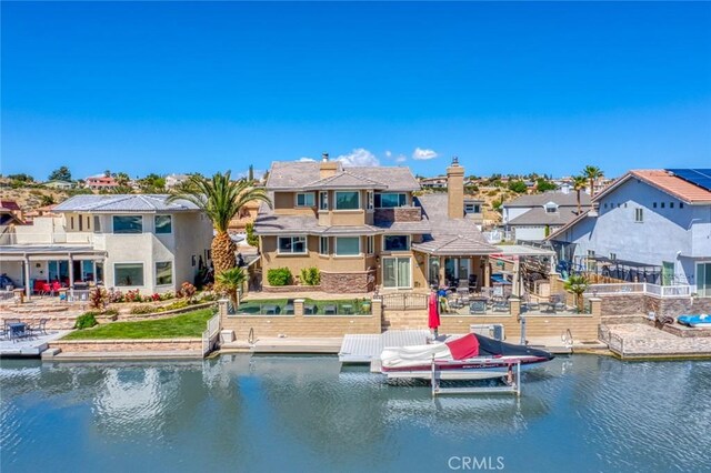 13545 Anchor Dr, Victorville, CA 92395 - rear view of property featuring a residential view, a water view, stucco siding, and a patio area