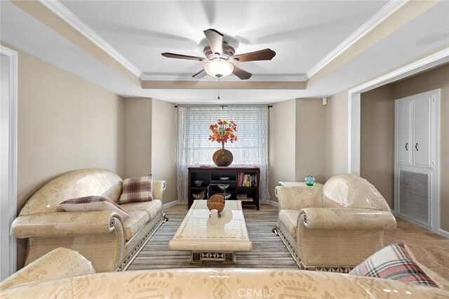13545 Anchor Dr, Victorville, CA 92395 - living area featuring a tray ceiling, ceiling fan, crown molding, and baseboards