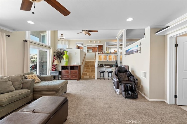 13545 Anchor Dr, Victorville, CA 92395 - carpeted living room featuring ceiling fan, crown molding, recessed lighting, stairway, and baseboards