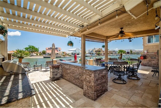 13545 Anchor Dr, Victorville, CA 92395 - view of patio / terrace featuring a pergola, exterior bar, a water view, and ceiling fan
