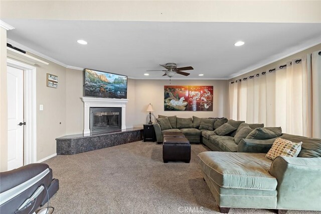 13545 Anchor Dr, Victorville, CA 92395 - living room featuring recessed lighting, carpet floors, ceiling fan, ornamental molding, and a glass covered fireplace