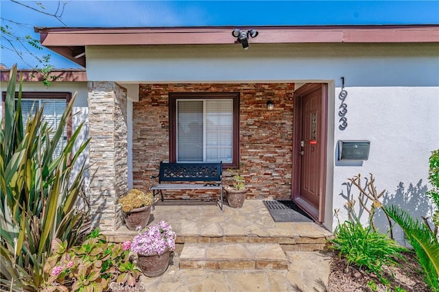 1933 W 147th St, Gardena, CA 90249 - view of exterior entry with stucco siding and a porch