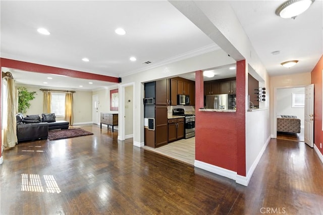 1933 W 147th St, Gardena, CA 90249 - kitchen featuring stainless steel appliances, baseboards, ornamental molding, wood finished floors, and open floor plan