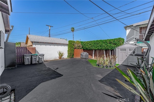 1933 W 147th St, Gardena, CA 90249 - view of patio with a shed, an outbuilding, and fence