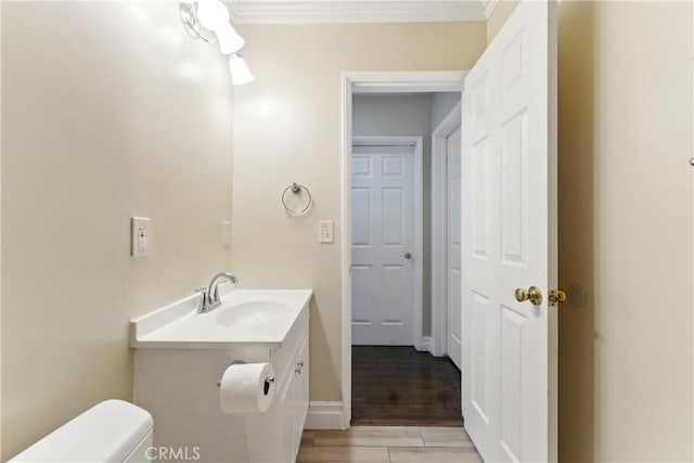 1933 W 147th St, Gardena, CA 90249 - half bath with vanity, toilet, and ornamental molding