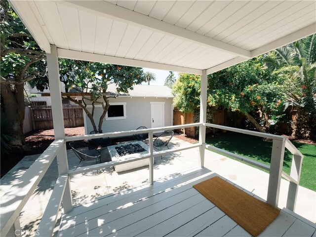 deck with a fenced backyard