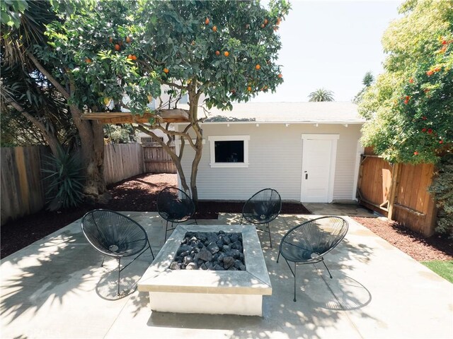 view of patio / terrace featuring a fire pit and a fenced backyard