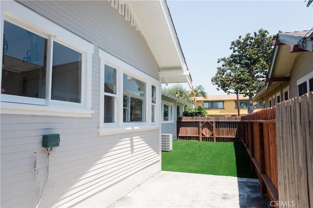 view of yard with central AC