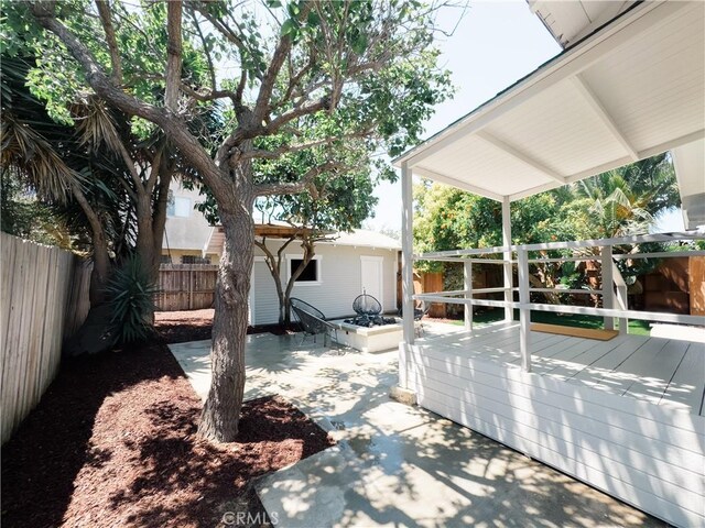 view of patio / terrace featuring a fenced backyard and a deck