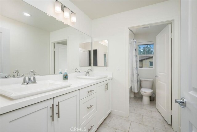23148 W Saratoga Way, West Hills, CA 91307 - full bath with double vanity, toilet, and baseboards