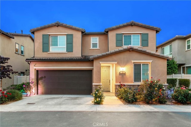 23148 W Saratoga Way, West Hills, CA 91307 - view of front of house featuring a garage, a tile roof, driveway, and stucco siding