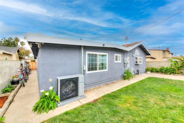 1417 E Abbottson St, Carson, CA 90746 - view of front of house featuring ac unit and stucco siding
