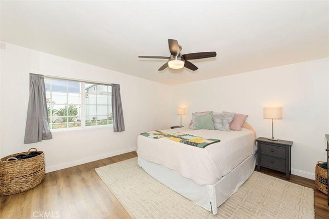 1417 E Abbottson St, Carson, CA 90746 - bedroom featuring wood finished floors, baseboards, and ceiling fan