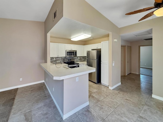 1074 Merrill Cir, Hemet, CA 92545 - kitchen featuring appliances with stainless steel finishes, tasteful backsplash, a ceiling fan, a peninsula, and light countertops