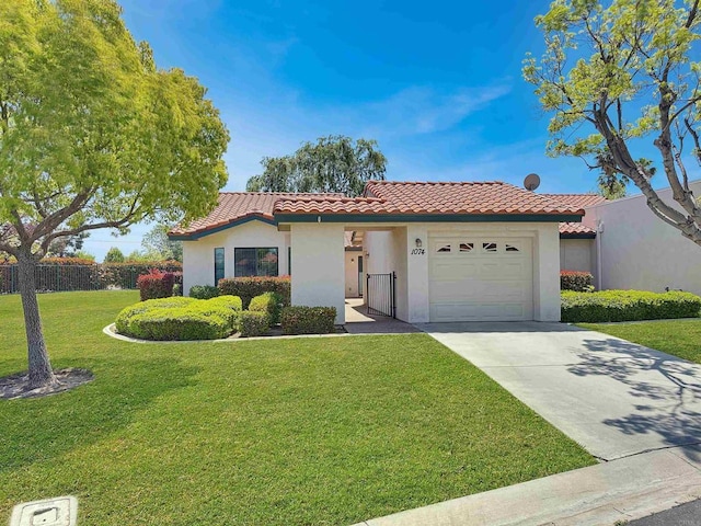 1074 Merrill Cir, Hemet, CA 92545 - mediterranean / spanish-style house with a tiled roof, an attached garage, concrete driveway, and stucco siding