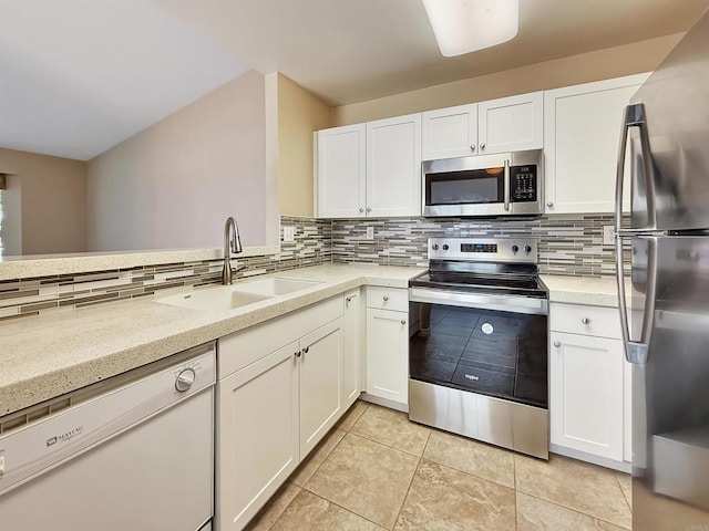 1074 Merrill Cir, Hemet, CA 92545 - kitchen featuring stainless steel appliances, a sink, decorative backsplash, and white cabinetry