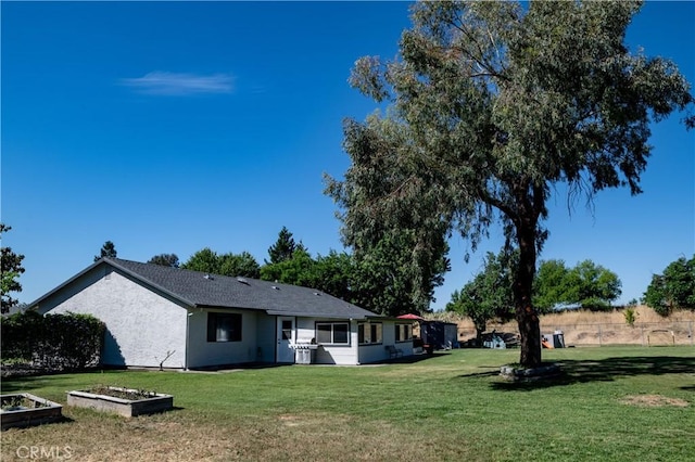 6338 Countryside Ct, Orland, CA 95963 - rear view of house featuring a lawn and stucco siding