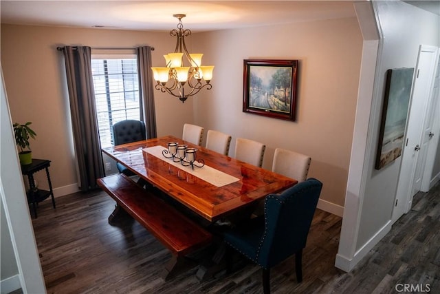 6338 Countryside Ct, Orland, CA 95963 - dining room with a chandelier, dark wood-type flooring, and baseboards