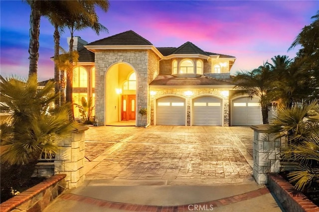 2638 Highridge Dr, Chino Hills, CA 91709 - view of front facade featuring stone siding, decorative driveway, and a chimney