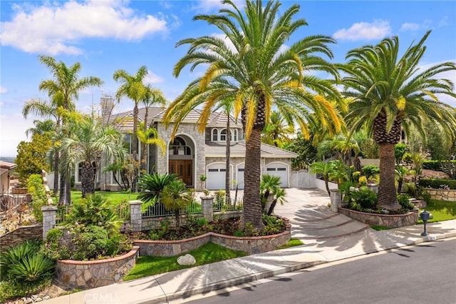 2638 Highridge Dr, Chino Hills, CA 91709 - view of front of property with driveway, stone siding, and fence