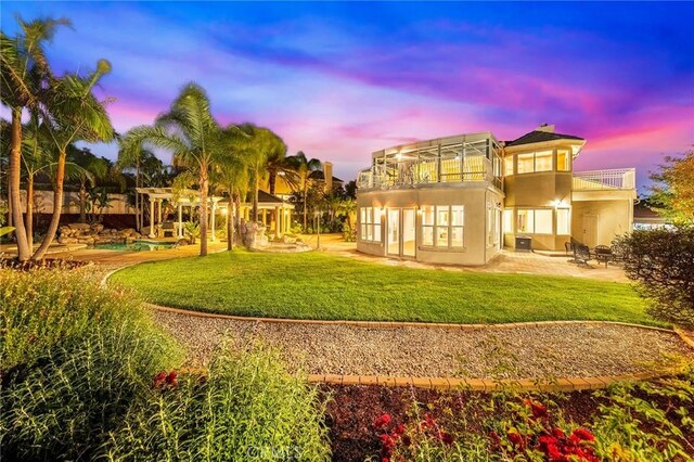 2638 Highridge Dr, Chino Hills, CA 91709 - back of property with a balcony, a patio, a yard, a pool, and stucco siding