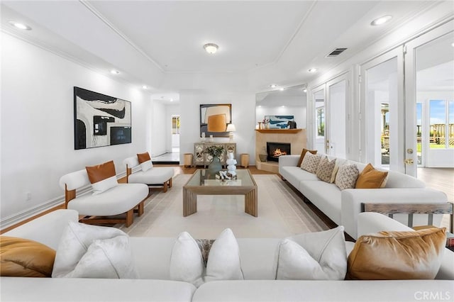 2638 Highridge Dr, Chino Hills, CA 91709 - living room featuring plenty of natural light, crown molding, a warm lit fireplace, recessed lighting, and light wood-type flooring