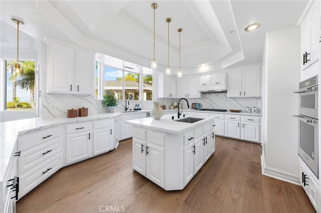 2638 Highridge Dr, Chino Hills, CA 91709 - kitchen with a tray ceiling, a sink, plenty of natural light, and recessed lighting