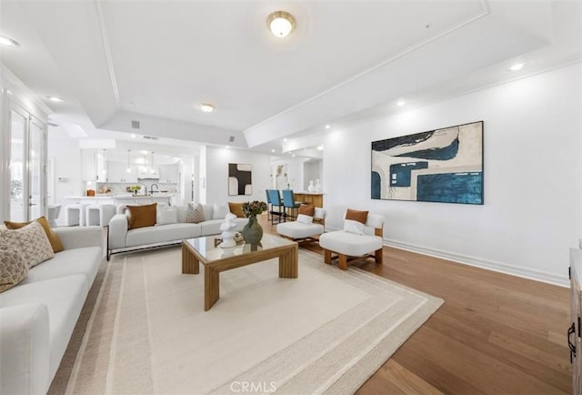 2638 Highridge Dr, Chino Hills, CA 91709 - living area featuring light wood-style flooring, baseboards, crown molding, recessed lighting, and a raised ceiling