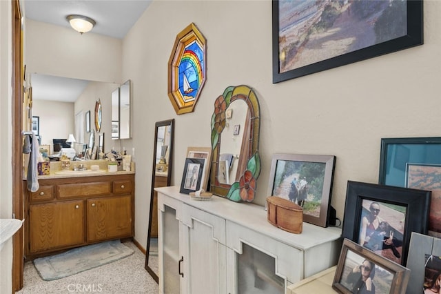 hallway featuring a sink
